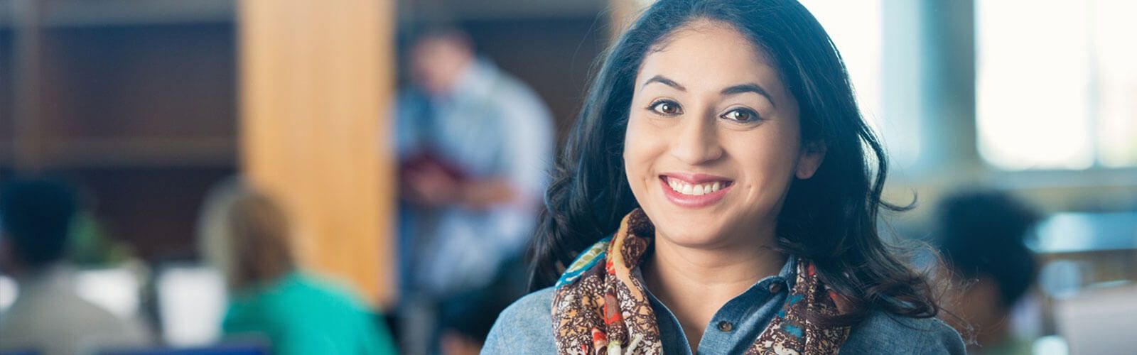 A woman posing and smiling.